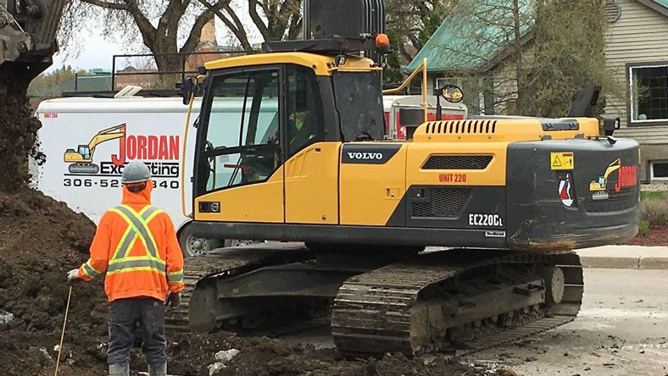 An excavator digging up ground