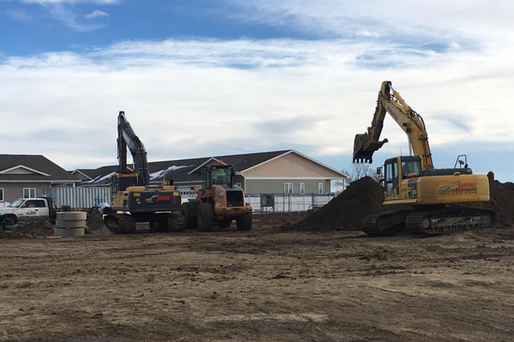 Multiple excavators digging